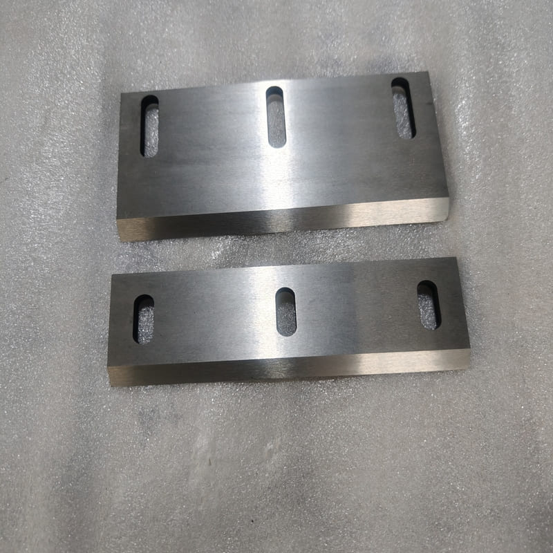 Different size industrial shredder blades with slotted mounting holes
